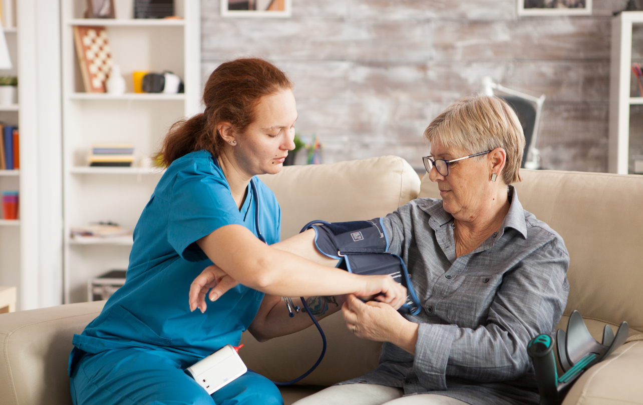 nurse caring patient at home